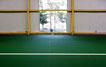 TK Prostjov  sliding gates on both longer sides of a tennis court for ventilation during summer